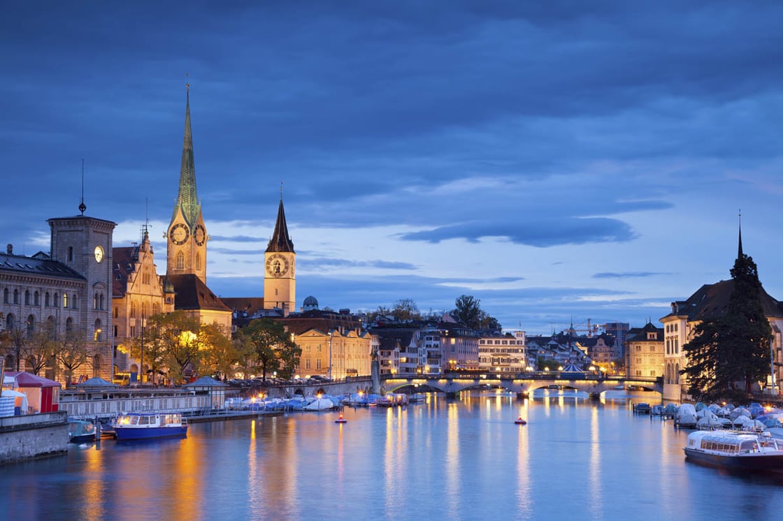 Lights shimmer on a river in Zurich