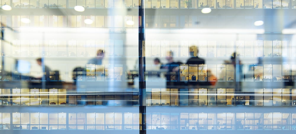 An external image looking into a bustling office block