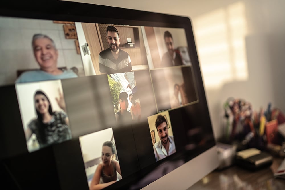 An over-the-shoulder shot of someone enjoying a fun-looking video call