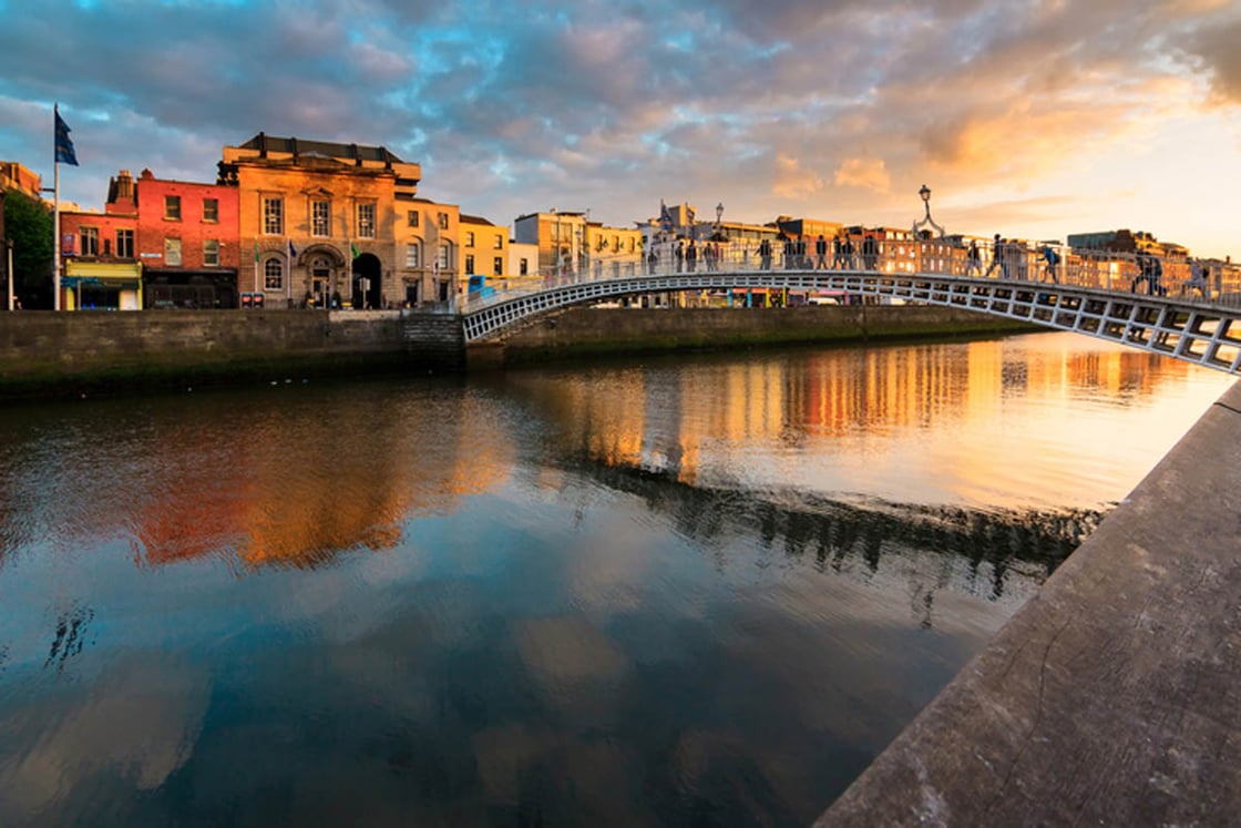 A sunsets over a bridge in Dublin