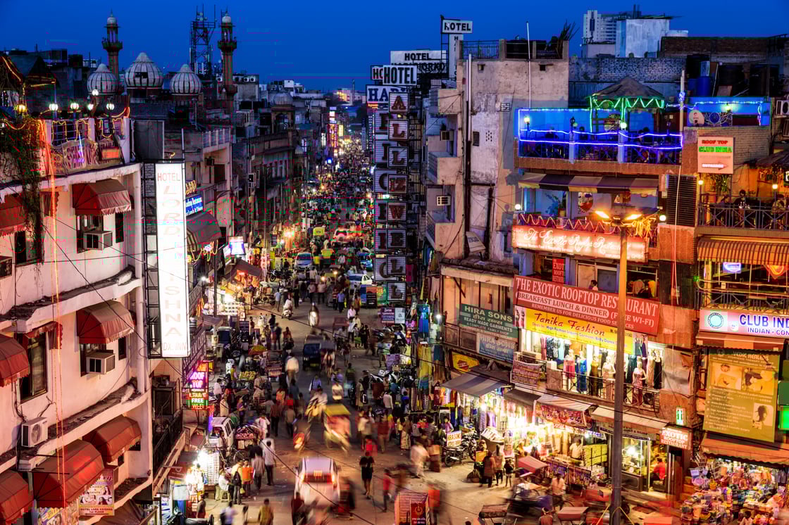 A bustling Indian city at night time